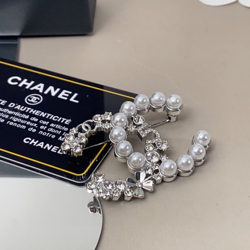 Ch*el brooches